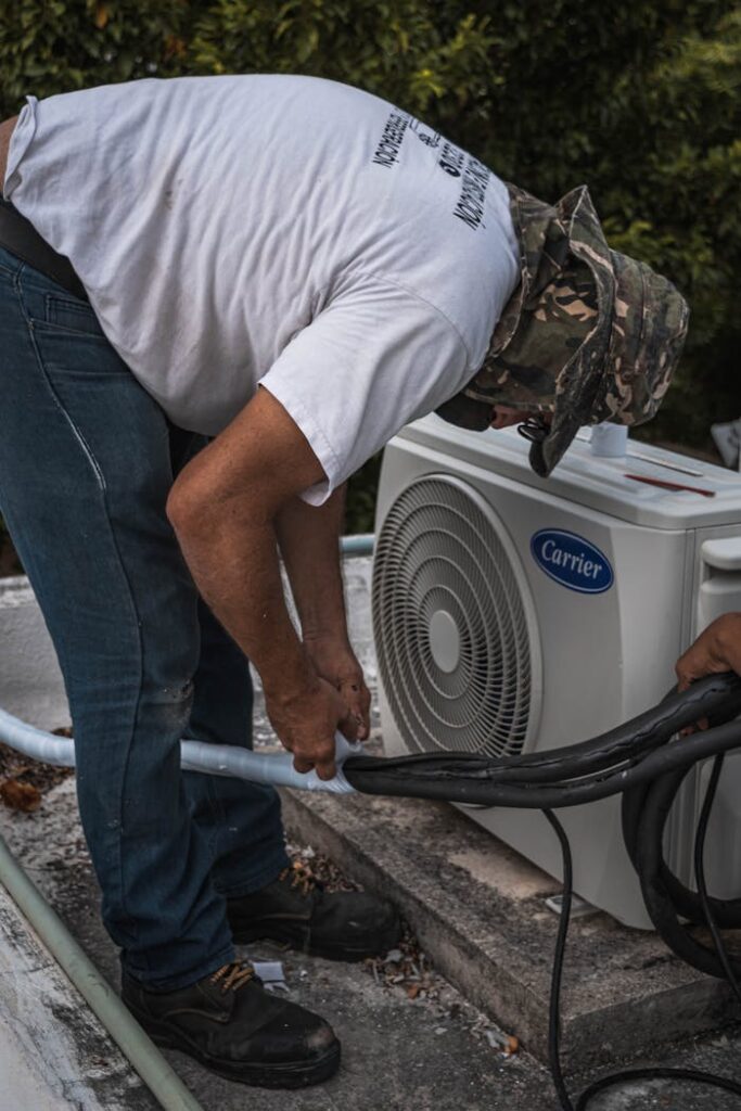 Man Taping a Hose